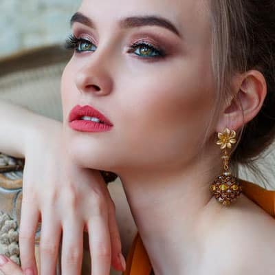 Beautiful woman with clear skincare, close-up portrait emphasizing radiant skin and beauty; perfect for skincare and dermatology services at Shrinika Derma Care.