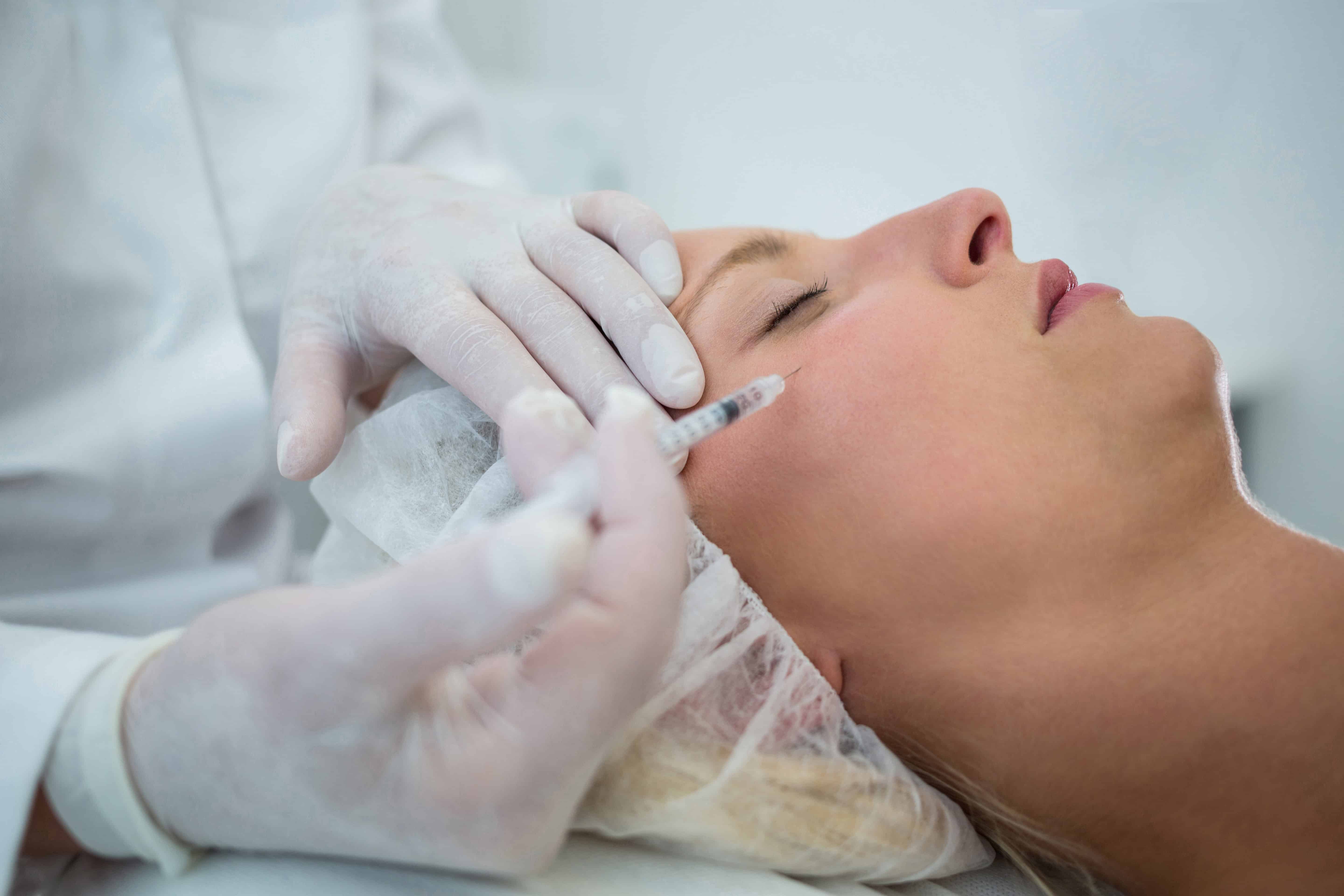 Aesthetic facial treatment with dermal injection for skin rejuvenation at Shrinika Dermatology Care. Skilled dermatologist performing cosmetic procedures for glowing, youthful skin.